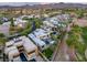 Expansive aerial view of a luxury home in a residential area near a golf course and rolling hills at 1337 Villa Barolo Ave, Henderson, NV 89052