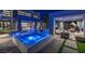 Beautiful backyard with pool, jacuzzi, outdoor lounge, and modern architecture providing luxury living at 1337 Villa Barolo Ave, Henderson, NV 89052