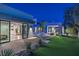 Stunning backyard with a sparkling pool, modern lounge area, lush landscaping, and sleek architectural design at 1337 Villa Barolo Ave, Henderson, NV 89052