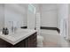 Modern bathroom featuring a shower-tub combo, sleek vanity with large mirror, and minimalist design at 1337 Villa Barolo Ave, Henderson, NV 89052
