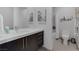 Bright bathroom features a modern vanity with white countertop, decorative art, and stylish fixtures at 1337 Villa Barolo Ave, Henderson, NV 89052