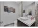 Stylish powder room featuring modern sink, mosaic tile accent, and contemporary decor at 1337 Villa Barolo Ave, Henderson, NV 89052