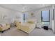 Bright bedroom with large windows, modern decor, and comfortable seating area at 1337 Villa Barolo Ave, Henderson, NV 89052