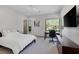 Comfortable bedroom with white linens, a large window, and modern furniture at 1337 Villa Barolo Ave, Henderson, NV 89052