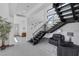 Bright entrance foyer showcases an open staircase, modern decor, and tiled flooring at 1337 Villa Barolo Ave, Henderson, NV 89052