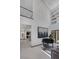 Grand entryway with high ceilings, modern art, and a grand piano at 1337 Villa Barolo Ave, Henderson, NV 89052