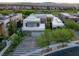 Modern home exterior with clean lines, stylish landscaping, and a spacious driveway, perfect for curb appeal at 1337 Villa Barolo Ave, Henderson, NV 89052