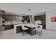 Modern kitchen with stainless steel appliances, large island, and sleek cabinetry at 1337 Villa Barolo Ave, Henderson, NV 89052