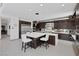 Modern kitchen with stainless steel appliances, custom cabinets, large island and high end finishes throughout at 1337 Villa Barolo Ave, Henderson, NV 89052