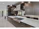Gourmet kitchen features granite countertops, stainless steel appliances, modern fixtures and custom cabinetry at 1337 Villa Barolo Ave, Henderson, NV 89052