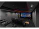 Home theater boasts plush seating, a large projection screen, and atmospheric lighting at 1337 Villa Barolo Ave, Henderson, NV 89052