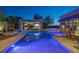 Backyard oasis with blue-lit pool, jacuzzi, covered lounge area with TV, and outdoor seating at 1337 Villa Barolo Ave, Henderson, NV 89052