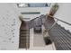 Open staircase with modern metal railing features views of natural light from above at 1337 Villa Barolo Ave, Henderson, NV 89052