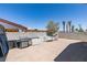 Backyard with a built-in grill, shade tree, and a patio area perfect for outdoor gatherings at 1905 Eskam St, Las Vegas, NV 89156
