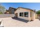 Enclosed backyard with patio space, a storage building, and easy access to the house at 1905 Eskam St, Las Vegas, NV 89156