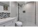 Contemporary bathroom featuring a glass enclosed shower, modern mosaic tiles, and white vanity at 1905 Eskam St, Las Vegas, NV 89156