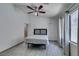 Bedroom with wood floors, ceiling fan, natural light, and ensuite bathroom at 1905 Eskam St, Las Vegas, NV 89156