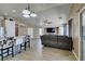 Spacious living room with lots of natural light, vaulted ceiling, wood floors, and leather sofa at 1905 Eskam St, Las Vegas, NV 89156