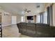 The living room features a vaulted ceiling, wood floors, fireplace, media center, and lots of natural light at 1905 Eskam St, Las Vegas, NV 89156