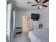 Main bedroom with wood floors, ceiling fan, natural light, and an ensuite bathroom at 1905 Eskam St, Las Vegas, NV 89156