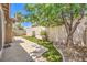 Backyard features grass, seating, and privacy wall at 201 Teller St, Henderson, NV 89074