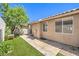 Relaxing backyard featuring artificial turf, desert landscaping, and access to the home's sliding glass door at 201 Teller St, Henderson, NV 89074