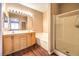 Bright bathroom features double sink vanity, soaking tub, and glass shower at 201 Teller St, Henderson, NV 89074