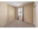 Bedroom with carpet, neutral walls, and window with curtains at 201 Teller St, Henderson, NV 89074