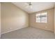 Neutral bedroom with plush carpeting and a window allowing for natural light at 201 Teller St, Henderson, NV 89074