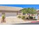 Charming home featuring a two-car garage, desert landscaping, and a tile roof at 201 Teller St, Henderson, NV 89074