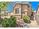 Charming home exterior with desert landscaping, a tile roof, and a walkway to the front door at 201 Teller St, Henderson, NV 89074