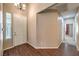 Bright foyer with wood floors, a large window, and an entry to the rest of the home at 201 Teller St, Henderson, NV 89074
