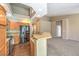 Kitchen with stainless steel appliances, breakfast bar, and views into the dining and living areas at 201 Teller St, Henderson, NV 89074