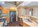 Kitchen featuring stainless steel appliances, a breakfast bar, and views into the adjacent living spaces at 201 Teller St, Henderson, NV 89074