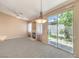 Spacious living room with a fireplace, sliding glass doors to the backyard, and an open concept design at 201 Teller St, Henderson, NV 89074