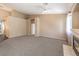 Spacious living room featuring neutral walls, a fireplace, carpet, and an open concept design at 201 Teller St, Henderson, NV 89074