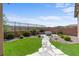 Well-maintained backyard with stone path, low-maintenance landscaping, and desert plants at 2207 Valdina St, Henderson, NV 89044