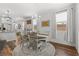 Bright dining area with a round table and chandelier, next to the kitchen at 2207 Valdina St, Henderson, NV 89044