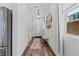 Bright entryway with hardwood floors, stylish lighting, and a cozy bench at 2207 Valdina St, Henderson, NV 89044