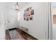 Open-concept entryway with a view of the front door and decorative wall art at 2207 Valdina St, Henderson, NV 89044