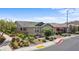 Charming home featuring lush landscaping, a gated courtyard, and desert-friendly yard at 2207 Valdina St, Henderson, NV 89044
