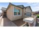 Close-up of a home's facade, showing the door, windows, and landscaping at 2207 Valdina St, Henderson, NV 89044