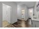 Hallway with wood-look flooring and access to a bathroom and other rooms at 2207 Valdina St, Henderson, NV 89044