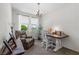 Comfortable home office with a cozy armchair and a well-lit work desk at 2207 Valdina St, Henderson, NV 89044
