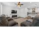 Spacious living room with a fireplace, comfortable seating, and an open layout at 2207 Valdina St, Henderson, NV 89044