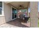 Charming covered patio with ceiling fan offering an ideal outdoor cooking and dining space at 2207 Valdina St, Henderson, NV 89044
