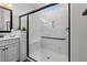 Clean shower showcases marble-like walls, built-in seating, and a sleek glass door at 2207 Valdina St, Henderson, NV 89044