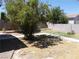 Backyard featuring a blend of grassy and graveled areas, plus a brick trimmed garden at 2211 Chipplegate Way, North Las Vegas, NV 89032