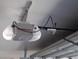 A LiftMaster garage door opener unit installed on the ceiling of the garage at 2211 Chipplegate Way, North Las Vegas, NV 89032