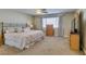 Cozy bedroom with neutral tones, a plush bed, and a window with natural light at 2418 Brockton Way, Henderson, NV 89074